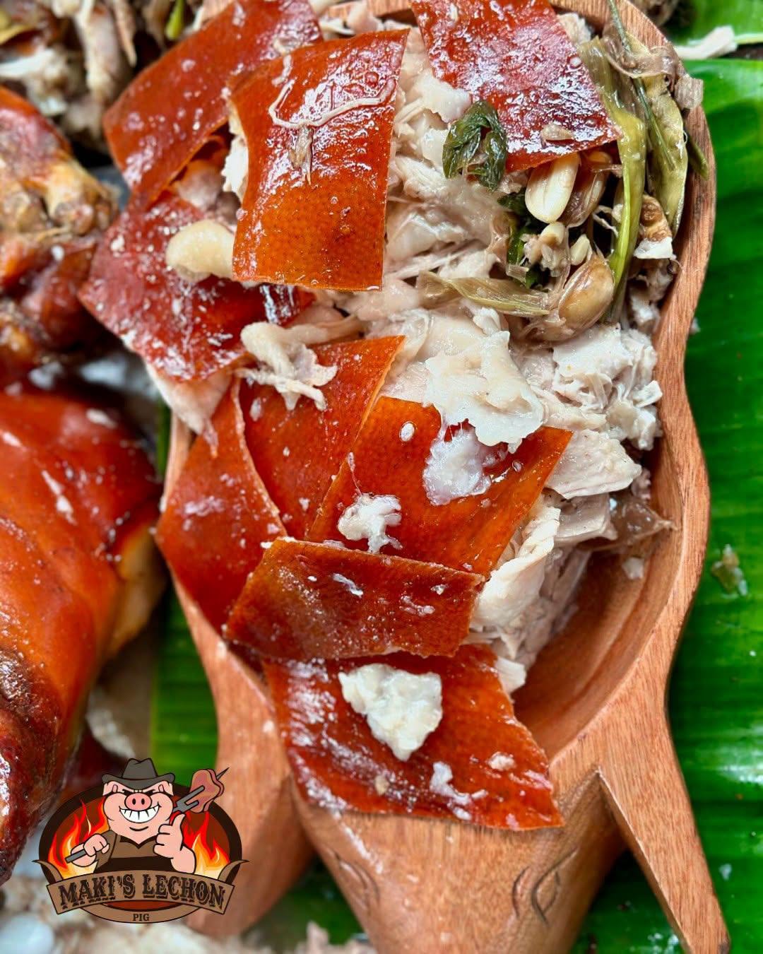Freshly chopped lechon on a wooden lechon boat